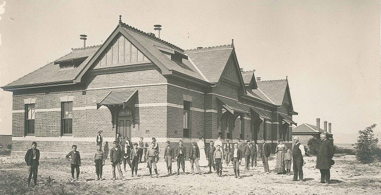 Image:&nbsp;Staff and boys outside the main dormitory at Tally Ho Boys' Training Farm, 1908. Courtesy Uniting Heritage Service, Victoria.