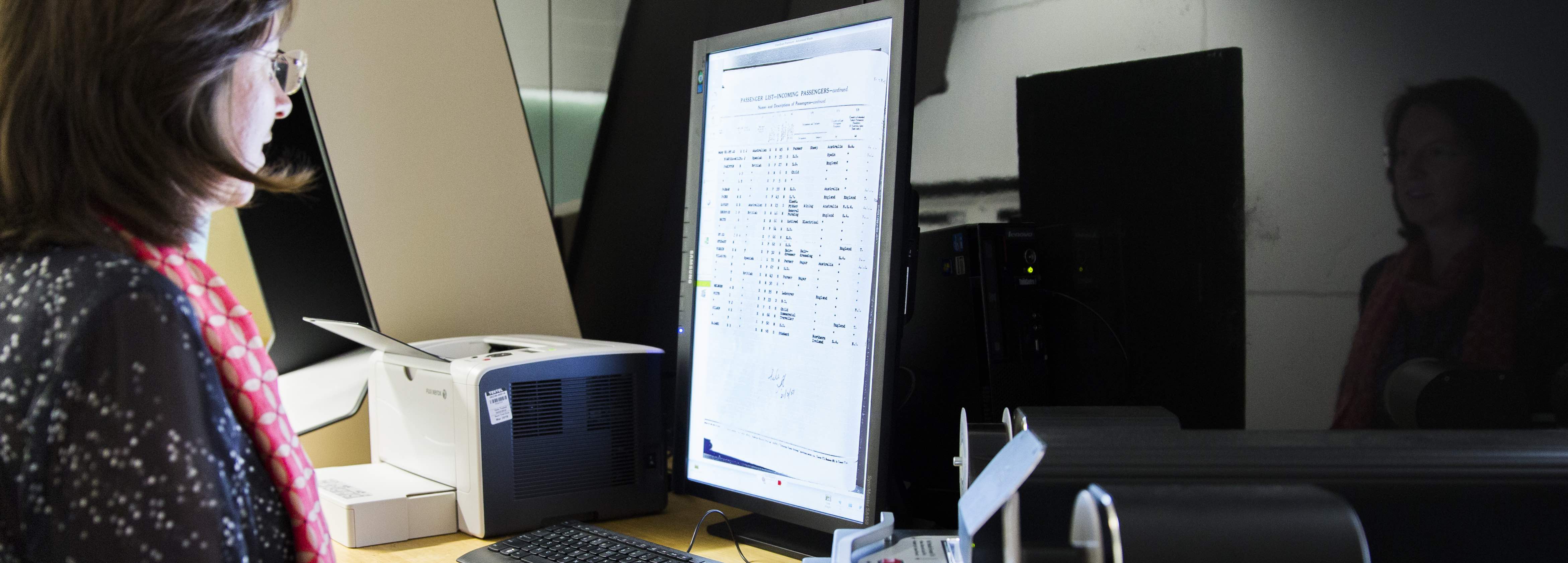 Archivist working at computer